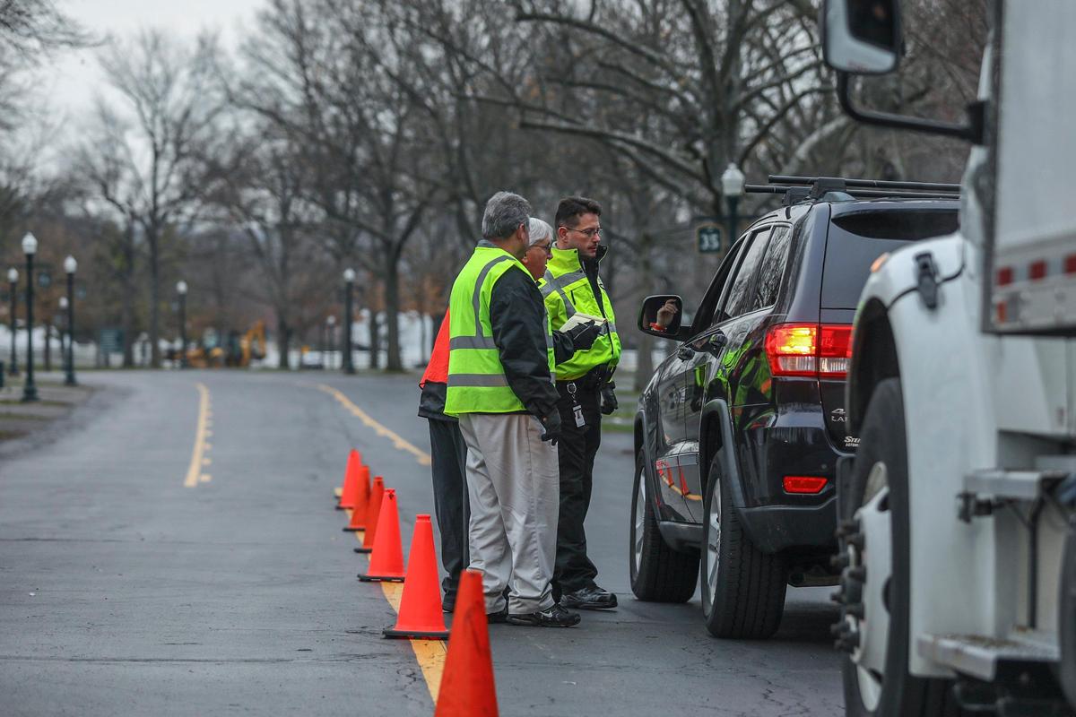 Frank Lea, from left, Obie Barber and J.C. Stewart, members of Keeneland security, check a visitor at Gate 2 on Monday, March 16, 2020. Beginning Monday, Keeneland is closed to all non-essential guests and horsemen. According to a media release, screening checkpoints are at Gates 1, 2, 3 and at the Rice Road barn entrance to monitor those seeking access to Keeneland.