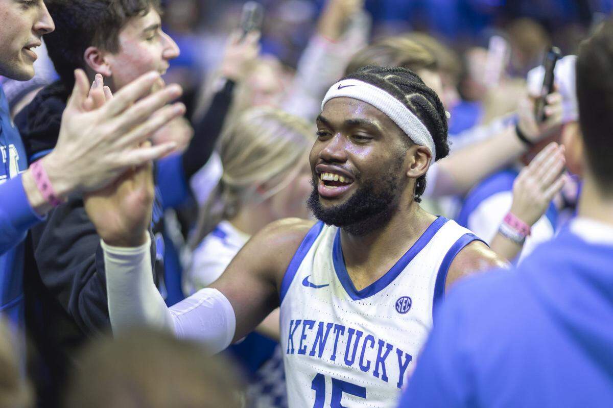 Kentucky forward Ansley Almonor (15) celebrates with fans following Tuesday’s win against Tennessee at Rupp Arena.