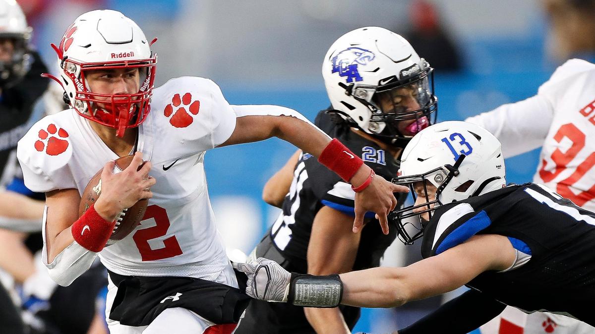 Beechwood’s Cameron Hergott (2) ran past Lexington Christian’s Elijah Hammond (13) during the Class 2A 2020 UK Orthopaedic Surgery & Sports Medicine State Football Finals at Kroger Field in Lexington, Ky., Friday, Dec. 18, 2020. The Tigers and Eagles are 1-2 in this week’s AP rankings.