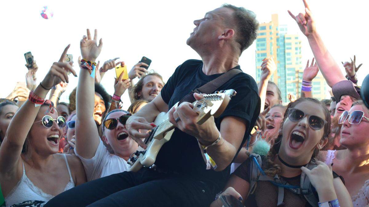 Cage the Elephant's Brad Shultz jumped into the crowd at the 2017 Forecastle Festival. The event returns -- without Cage, sorry fans -- to Louisville's Waterfront Park July 13 to 15.