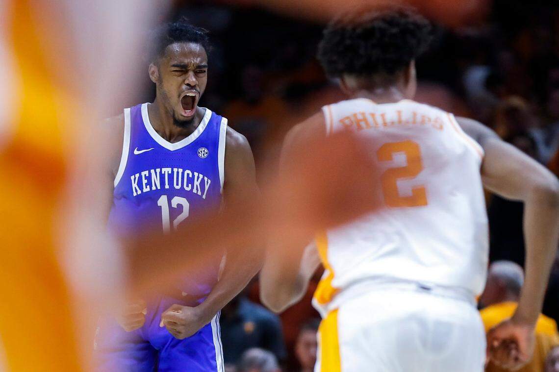 Kentucky’s Antonio Reeves (12) celebrates making a three-point shot against Tennessee during the second half in Knoxville. Reeves led the Wildcats with 18 points.