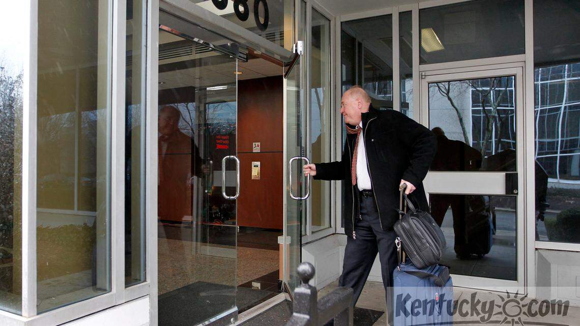 Steve Baker, who directs the Federal Trade Commission's Midwest office in Chicago, entered a building at 880 Corporate Dr. in Lexington, Ky., Monday, Jan. 28, 2013. Officials with Kentucky Attorney General Jack Conway's office and the FTC were inside the Lexington headquarters of Fortune Hi-Tech Marketing company sending employees of the multi-level marketing firm home. Photo by Charles Bertram | Staff





