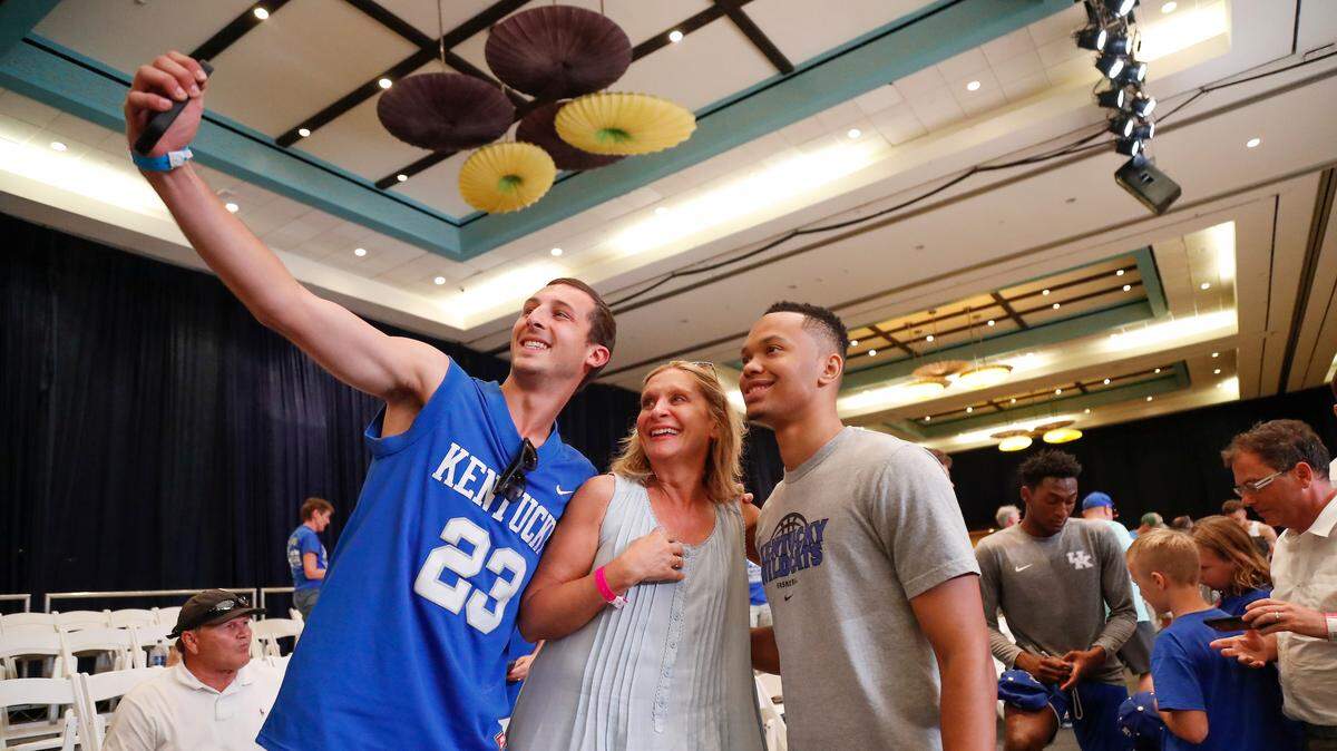 Kentucky player Jemarl Baker paused for a photo with UK fans during the Wildcats’ open practice in the Bahamas on Tuesday. Coach John Calipari seemed to encourage fan-player interaction in the intimate surroundings at the Atlantis Resort.