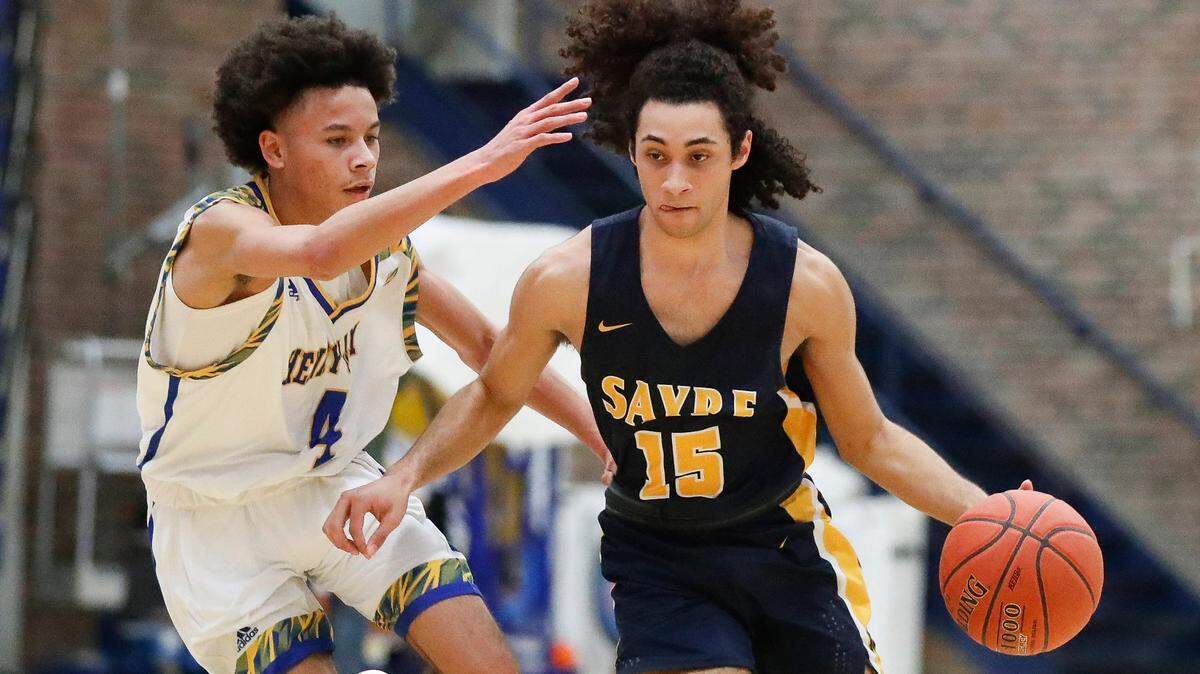 Sayre’s Zander Collett (15) dribbled around Henry Clay’s Sincere Madison (4) during their game at Henry Clay on March 4, 2021. Collett and the Spartans will play in this week’s All “A” Classic.