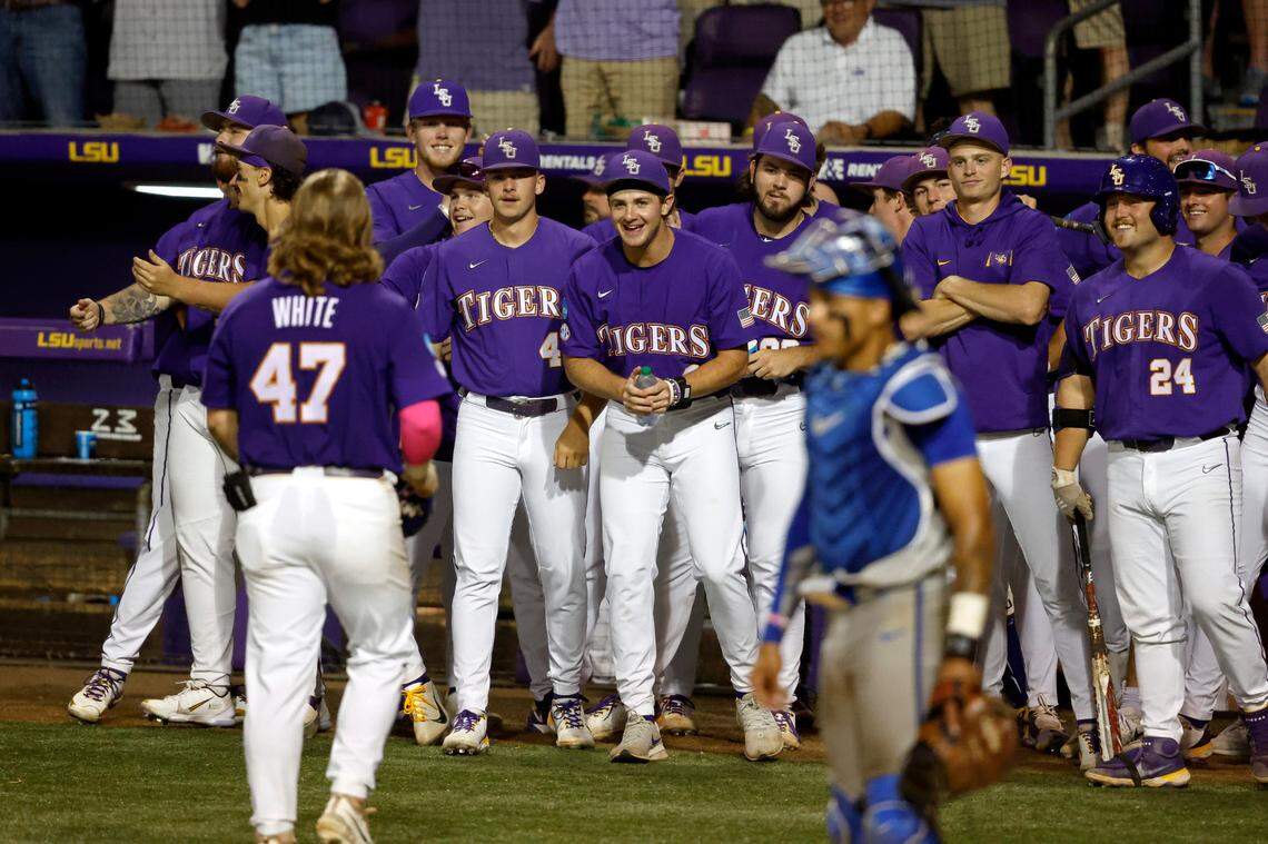 LSU infielder Tommy White (47) celebrates with teammates after hitting a home run during the sixth inning against Kentucky in Baton Rouge, La., on Saturday night.