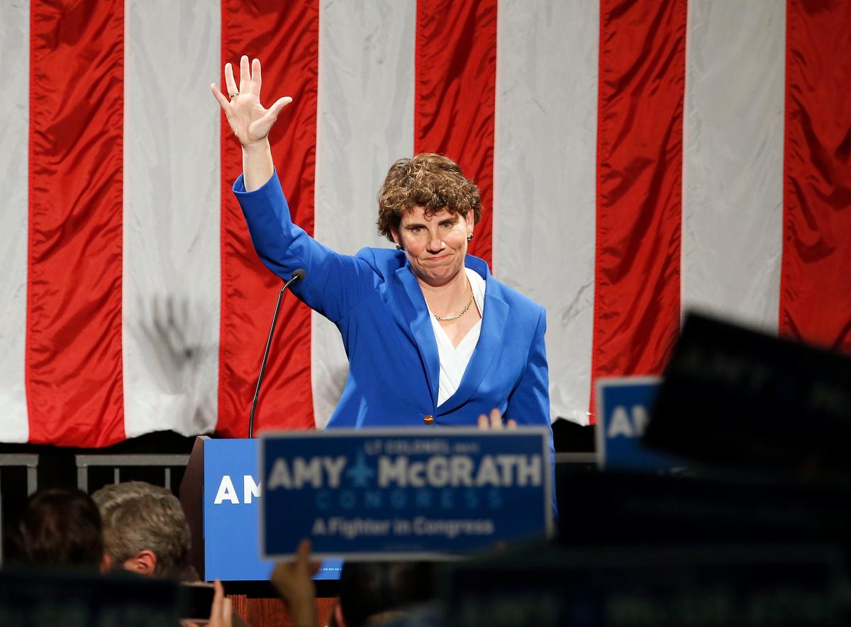 Retired U.S. Marine Lt. Colonel Amy McGrath waved to her supporters after she gave her concession speech Tuesday nighty in the lobby of the Eastern Kentucky University Center for the Arts in Richmond, Ky. McGrath was defeated by incumbent Republican Congressman Andy Barr.