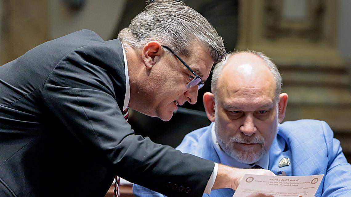 Senate Majority Caucus Chair Robby Mills, R-Henderson, confers with Sen. Matthew Deneen, R-Elizabethtown, on the Senate floor in 2025.