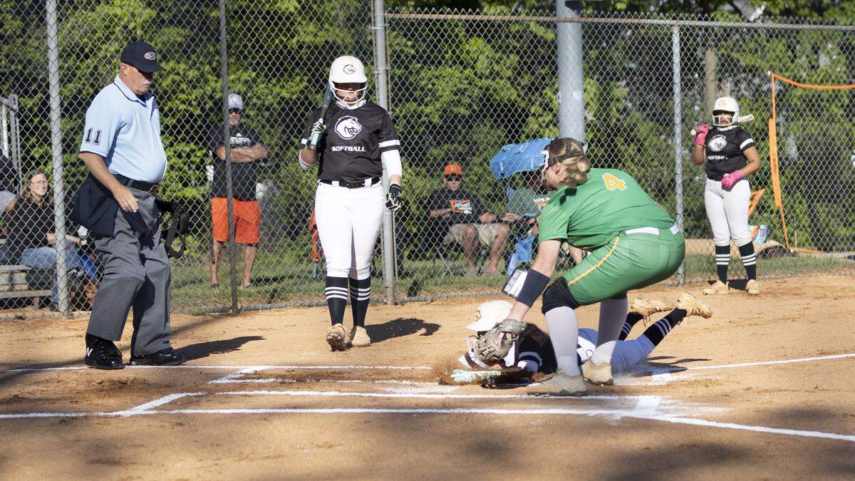 Frederick Douglass’ Emma Dunn slides into home plate ahead of the tag by Bryan Station’s Karsyn Rockvoan in the first inning of the Broncos’ 11-4 victory at Bryan Station High School on Thursday.