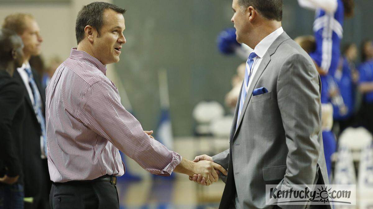 Louisville Cardinals head coach Jeff Walz and Kentucky Wildcats head coach Matthew Mitchell talk before their game at Memorial Coliseum Sunday, Dec. 1, 2013 in Lexington, Ky. Photo by Amy Wallot