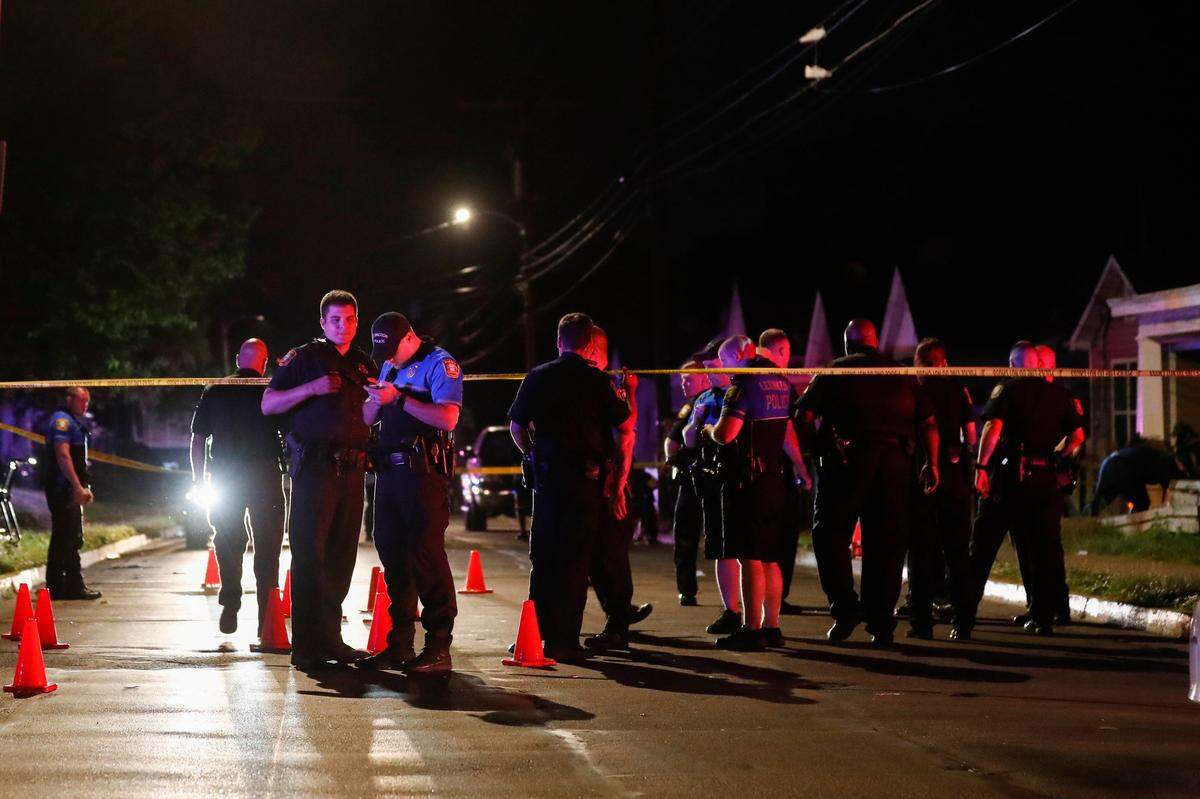 Lexington police investigate the scene of a shooting near the intersection of East Sixth Street and Chestnut Street in Lexington, Ky., Thursday, May 27, 2021. Two people were transported from the scene by ambulance with unknown injuries.