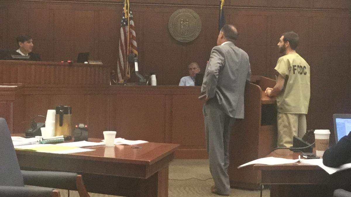 Fayette Circuit Judge John Reynolds, left, presided during the sentencing of James Anthony Blythe, far right. Defense attorney Derek Gordon, in gray suit, represented Blythe.
