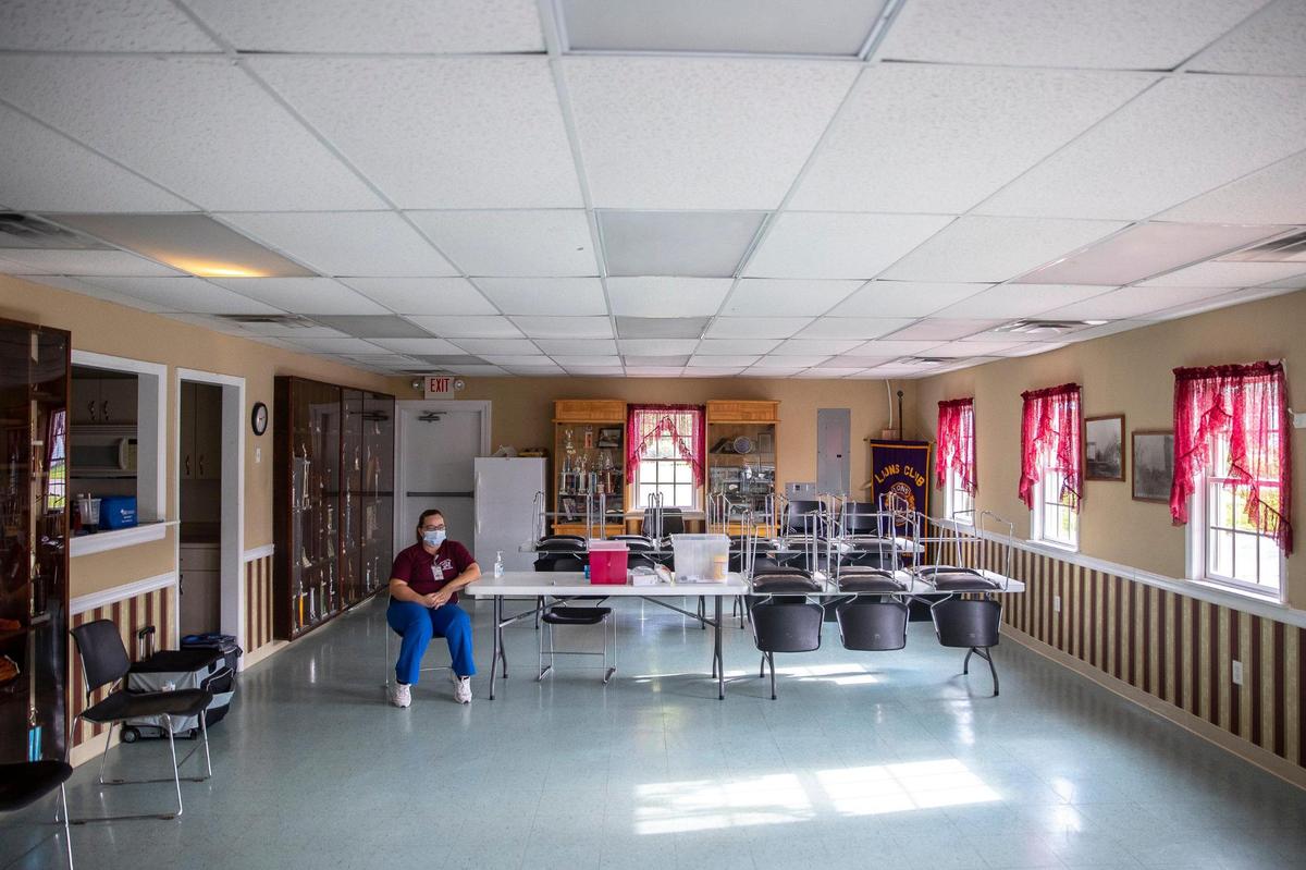 Linda Stahl, Buffalo District Health Department clinic nurse, waits to administer the COVID-19 vaccine at the Germantown, Ky., community center and volunteer fire department on Wednesday, July 14, 2021. During the 2-hour pop-up clinic, no one came seeking a vaccine.