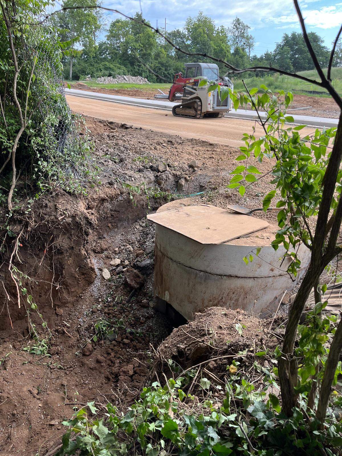 The district is already widening roads and building infrastructure on land they are trying to acquire under eminent domain at their new Versailles Road school.