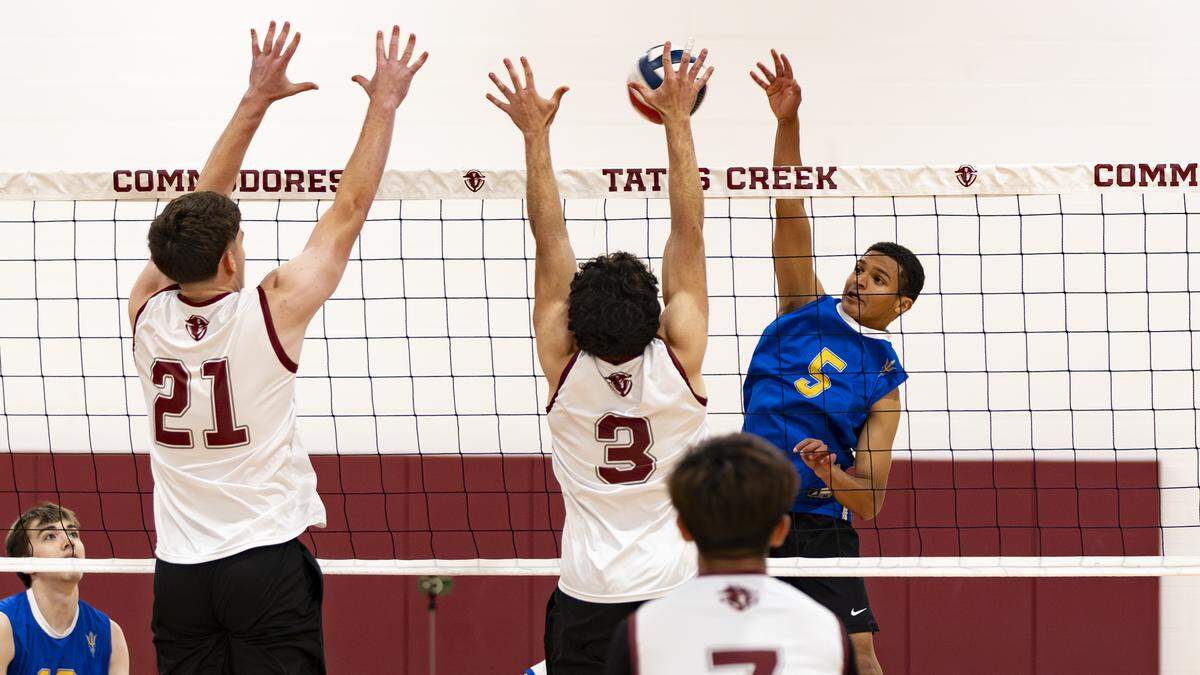 Henry Clay’s Cameron Garrett spikes a ball at the Tates Creek defense during the Blue Devils 3-0 win at Tates Creek High School on Wednesday.