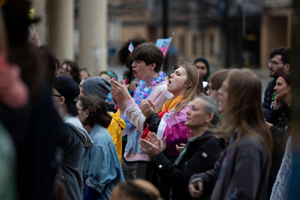 People gather for a rally organized by LGBTQ youth and adults in opposition to Senate Bill 150 and also to celebrate Trans Day of Visibility in Lexington, Ky., Friday, March 31, 2022.