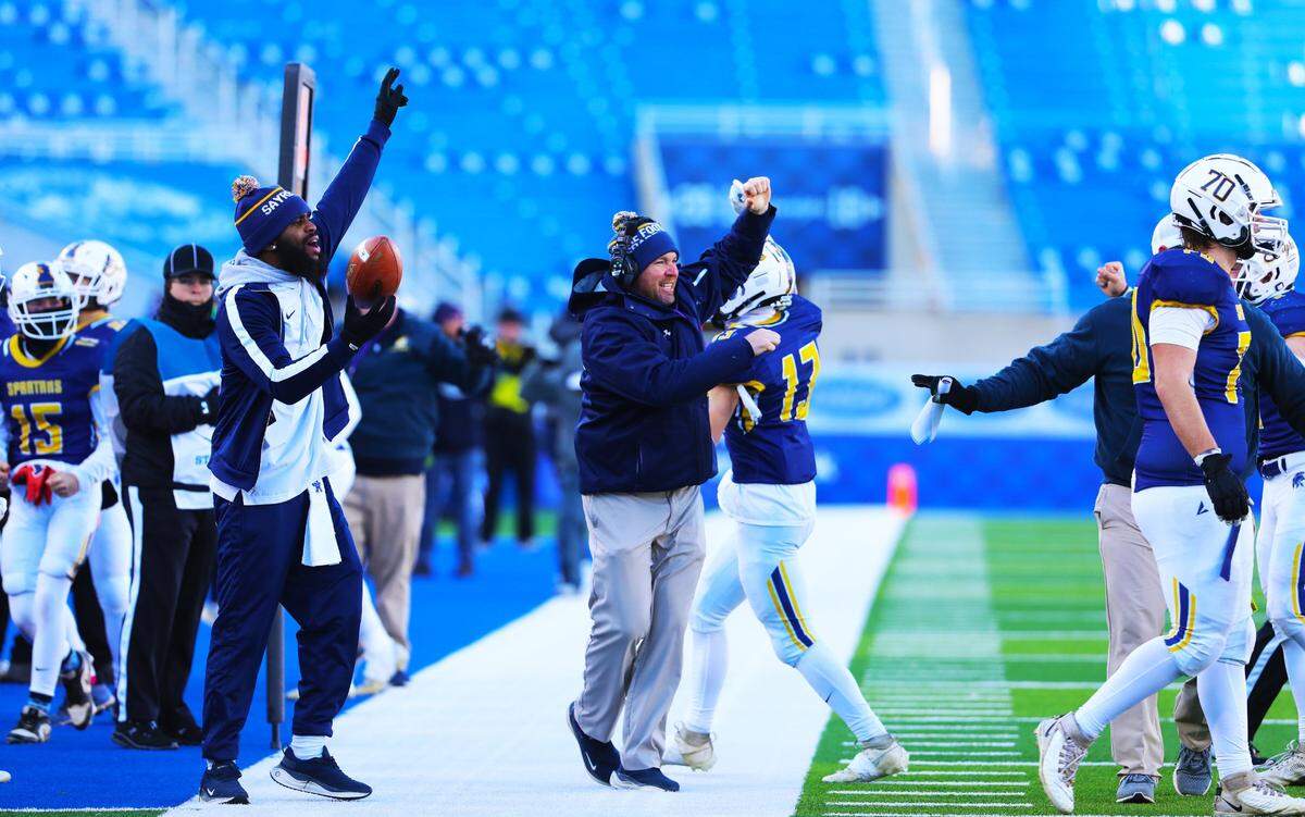 Sayre’s sideline celebrates the school’s first football state championship.