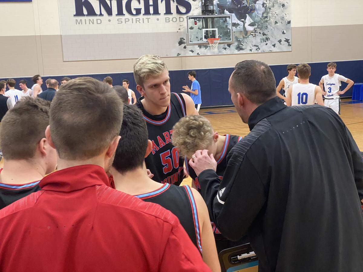 Martin County and standout Trey James, center, were slated to be the first team from the Eastern Kentucky county to play in a Boys’ Sweet Sixteen in the past 37 years.