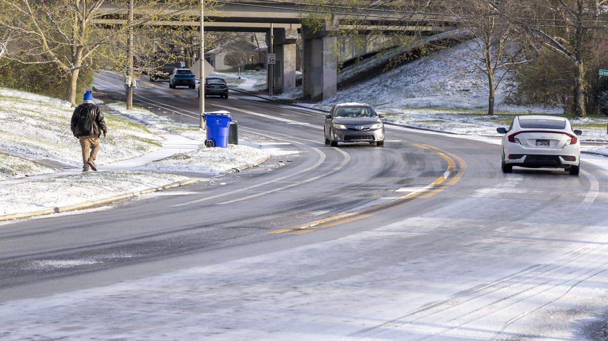 Traffic moves up Greentree Road, Tuesday, March 17, 2026 in Lexington, Ky. Slippery road conditions caused many crashes across the city after winter weather moved through the area.