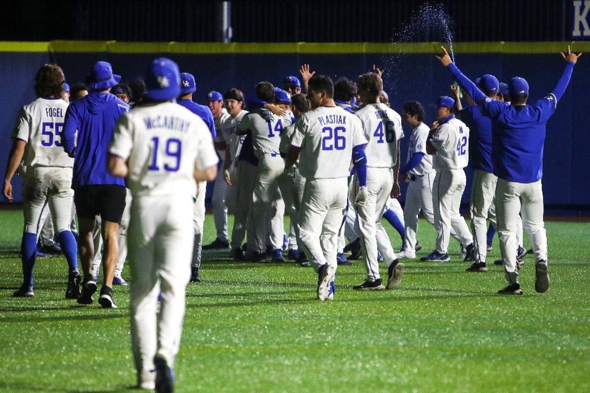 The UK baseball team celebrates after a walk-off single by catcher Alonzo Rubalcaba against No. 1 Tennessee in the 13th inning at Kentucky Proud Park in Lexington on Thursday night.