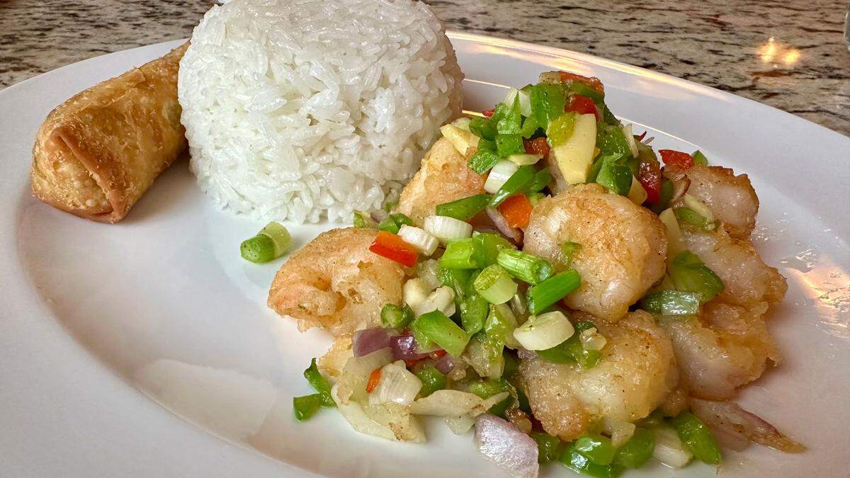 Salt and pepper shrimp with white rice and an egg role at Shun Lee Chinese Cuisine restaurant.