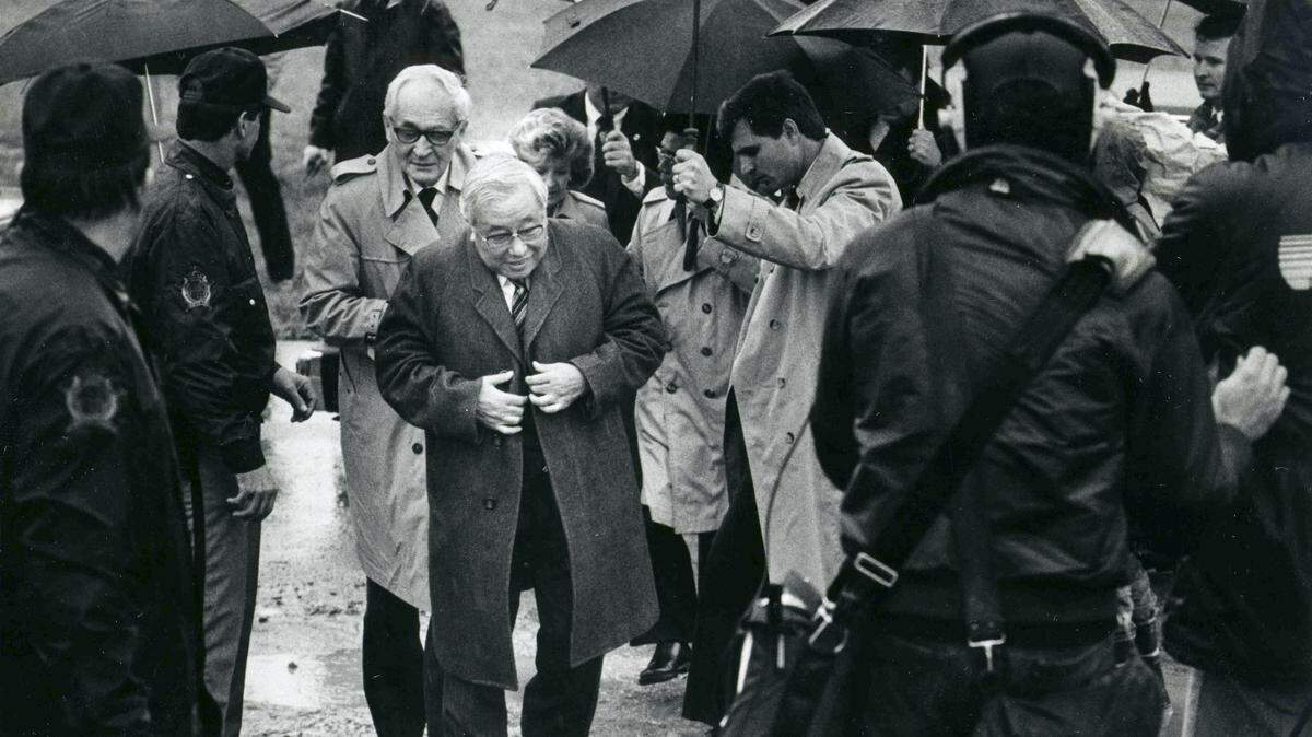 Eiji Toyoda, Chairman of the Board of Toyota Motor Corp., made his way up a muddy driveway as he arrived at the proposed plant site near Georgetown in December 1985.   