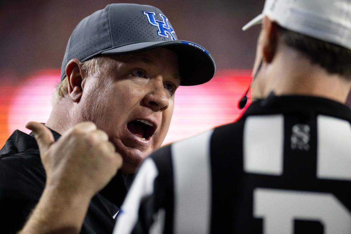 Oct 19, 2024; Gainesville, Florida, USA; Kentucky Wildcats head coach Mark Stoops argues a call with the referee against the Florida Gators during the second half at Ben Hill Griffin Stadium. Mandatory Credit: Matt Pendleton-Imagn Images