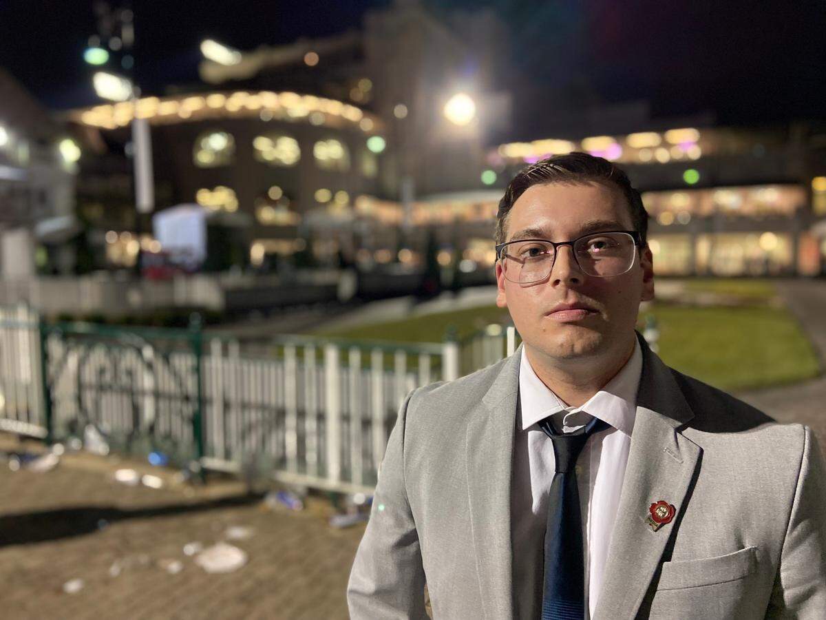 Lexington Herald-Leader sports reporter Cameron Drummond poses for a portrait near the Churchill Downs paddock in Louisville following the 2022 Kentucky Derby on Saturday. Drummond compared the Derby experience, in particular the infield, to the Indianapolis 500 automobile race, which he has attended before.
