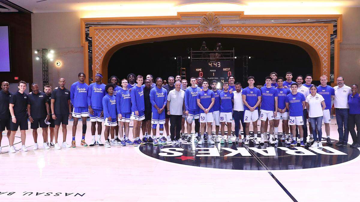 The University of Kentucky men’s basketball team posed for a photo with Thursday night’s opponent, Tec de Monterrey, before their exhibition game at Nassau, Bahamas.