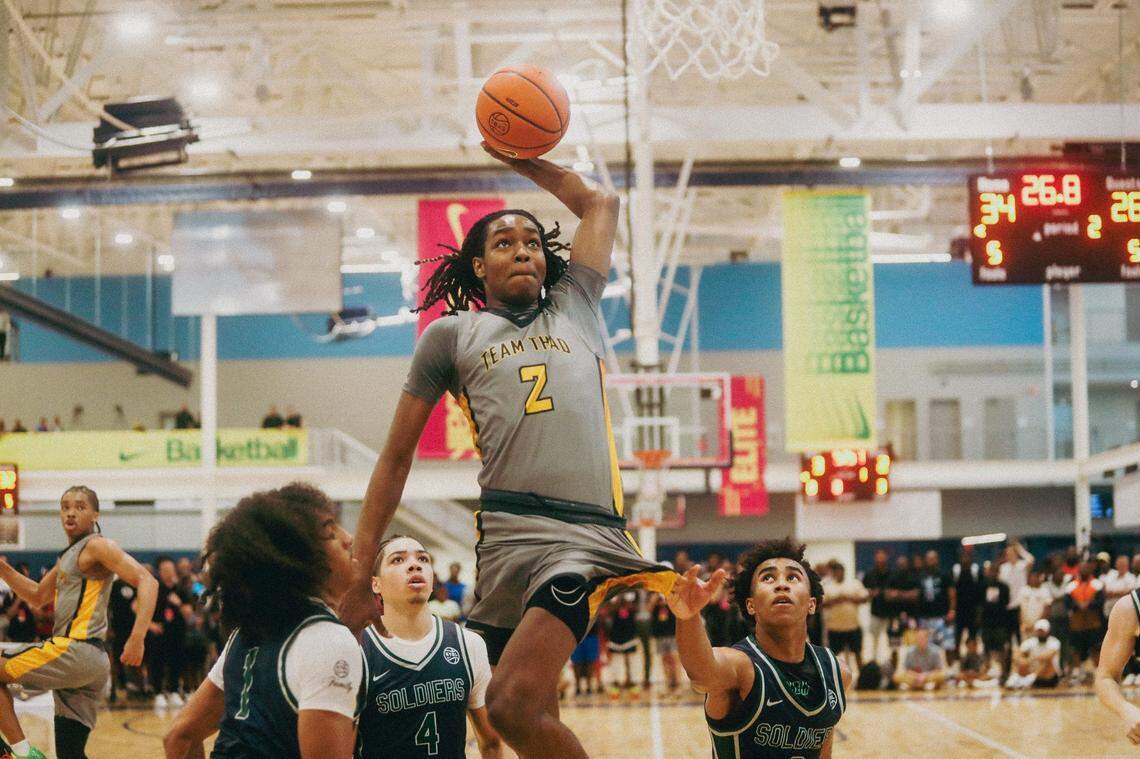Team Thad's Jasper Johnson (2) jumps in the air to dunk the ball during a game against Team Oak Soldiers during the Nike Elite Youth Basketball League session one on Saturday, April 27, 2024 at the Memphis Sports & Event Center in Memphis, Tenn.