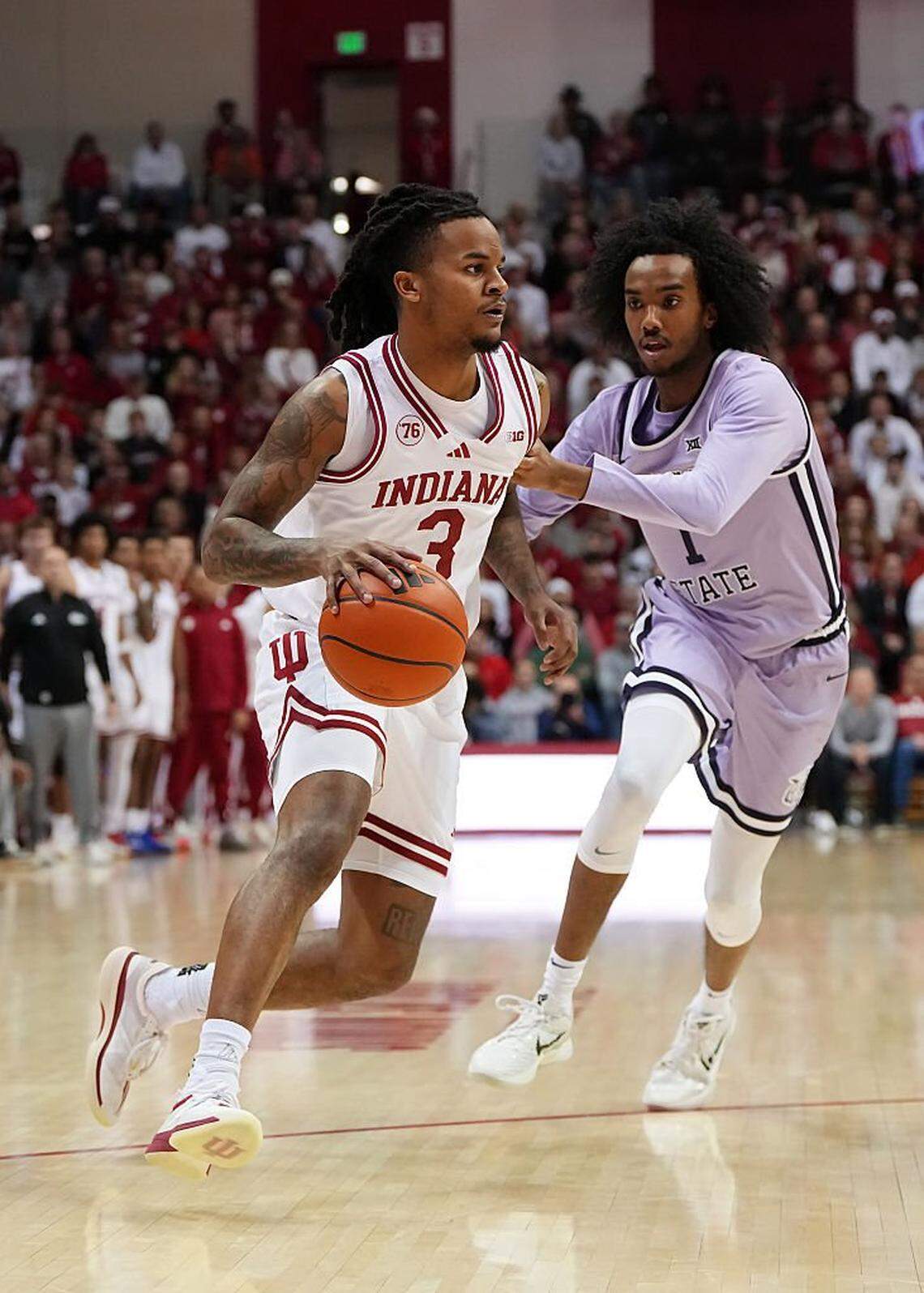BLOOMINGTON, INDIANA - NOVEMBER 25: Lamar Wilkerson #3 of the Indiana Hoosiers dribbles the ball while being guarded by Abdi Bashir Jr. #1 of the Kansas State Wildcats in the first half at Simon Skjodt Assembly Hall on November 25, 2025 in Bloomington, Indiana. (Photo by Dylan Buell/Getty Images)