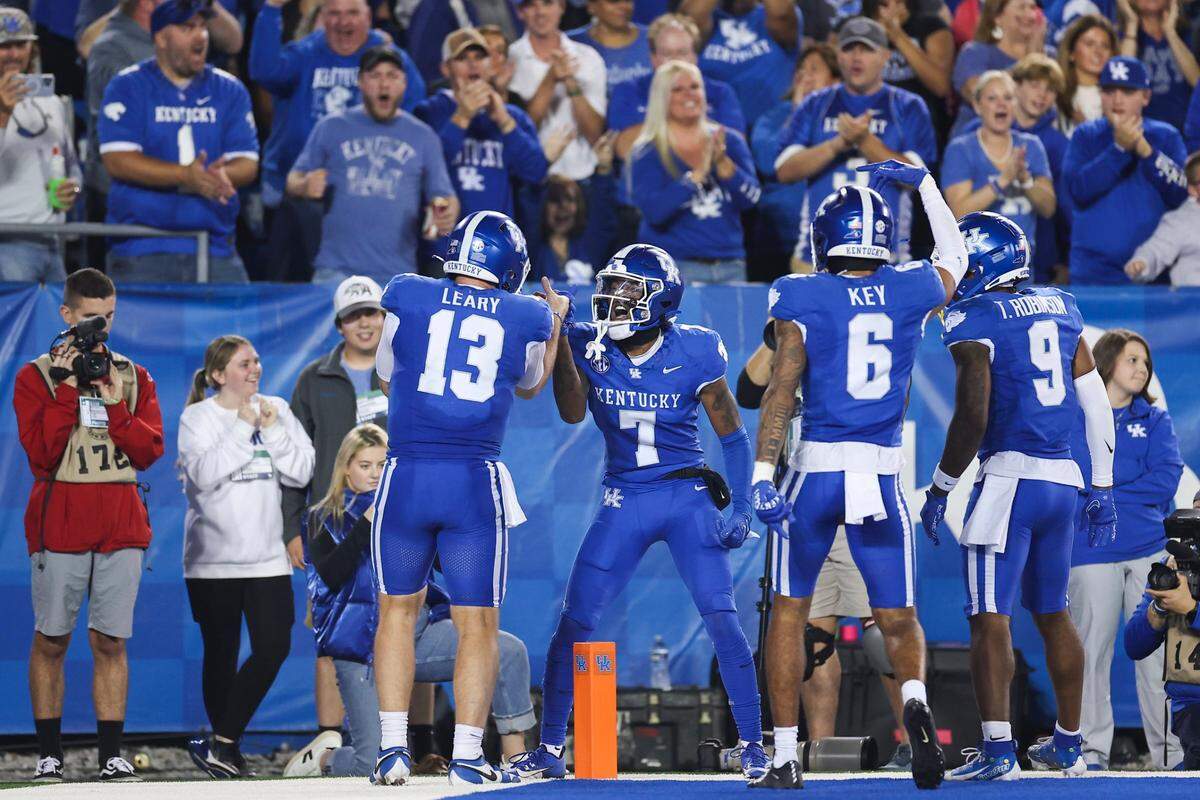 Kentucky wide receiver Barion Brown (7) celebrates with quarterback Devin Leary (13) after scoring a touchdown against Tennessee in the second quarter during Saturday’s game at Kroger Field.