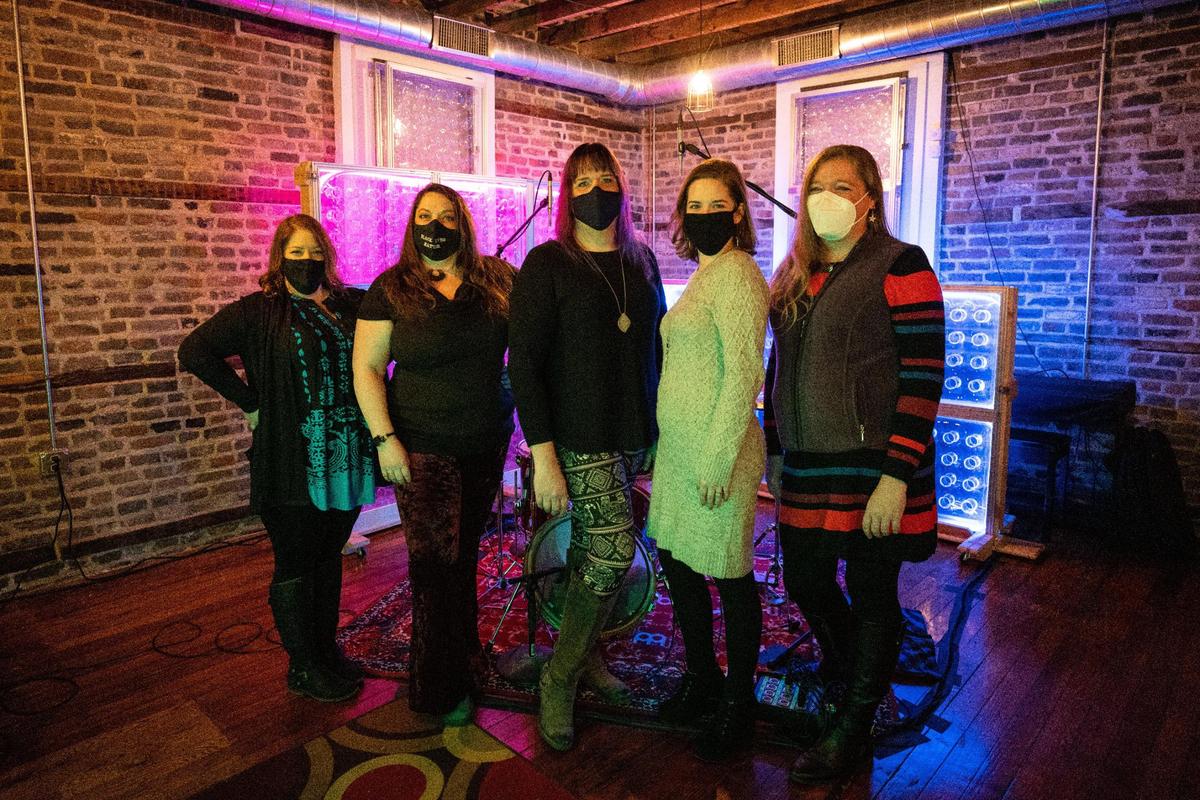 Members of Nitrosonic Studios (left to right) April Edwards, Amanda Aday, Danielle Barkman, Abigail Buettner, and Leah Arrington pose for a photo on Friday, Jan. 29, 2021, at Nitrosonic Studios in Lexington, Kentucky.