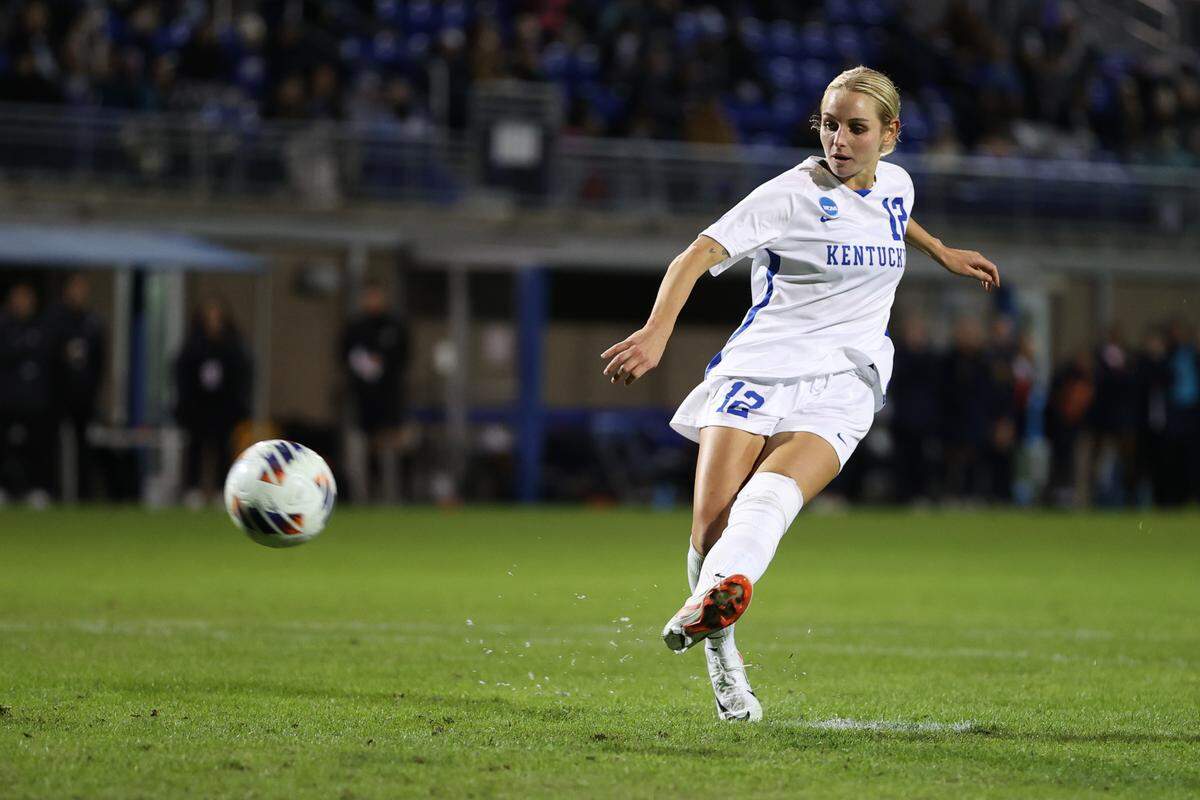Kentucky midfielder Sophia Mattice scores the winning penalty kick for UK against West Virginia in the first round of the NCAA Tournament on Friday at the Wendell and Vickie Bell Soccer Complex in Lexington.