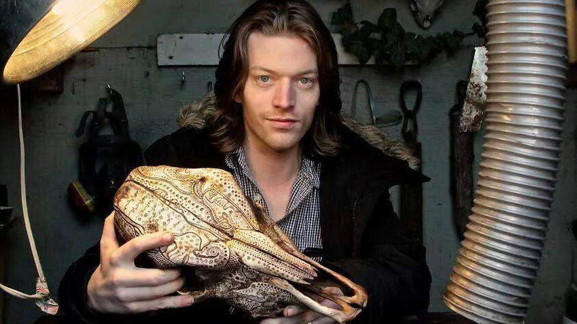 Artist Jason Borders, a Lexington native now based in Portland, Ore., creates designs on animal bones with a Dremel rotary tool, then inks them and applies a finish.