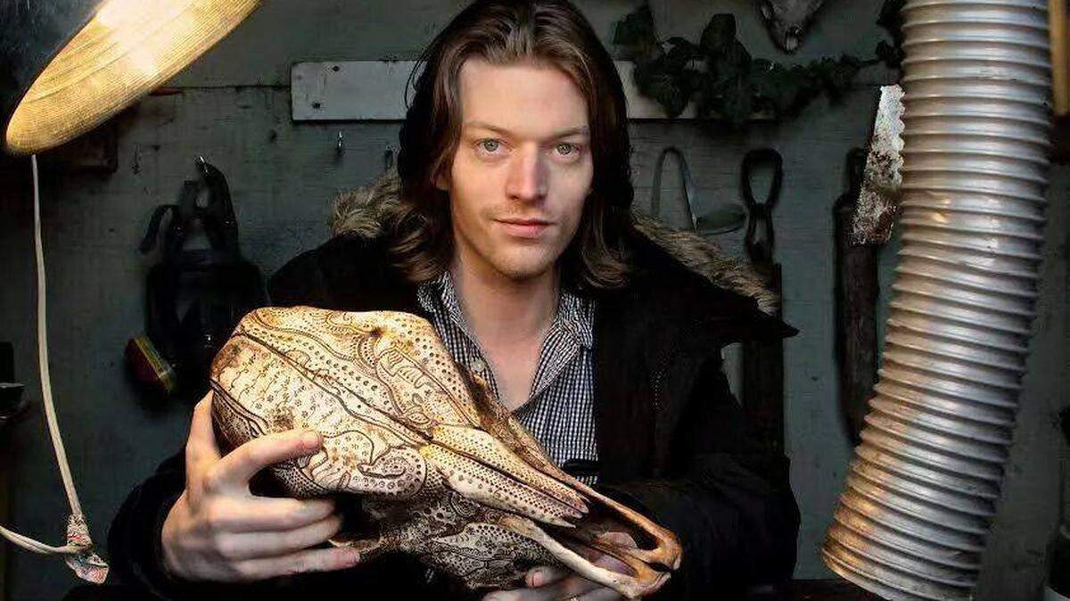 Artist Jason Borders, a Lexington native now based in Portland, Ore., creates designs on animal bones with a Dremel rotary tool, then inks them and applies a finish.