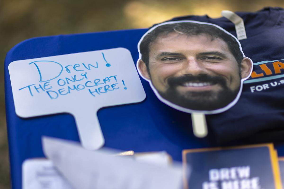 A table has campaign materials for John “Drew” Williams, a candidate for the U.S. House of Representatives, at the 145th annual Fancy Farm Picnic at St. Jerome Catholic Church in Fancy Farm, Ky., on Saturday, Aug. 2, 2025.