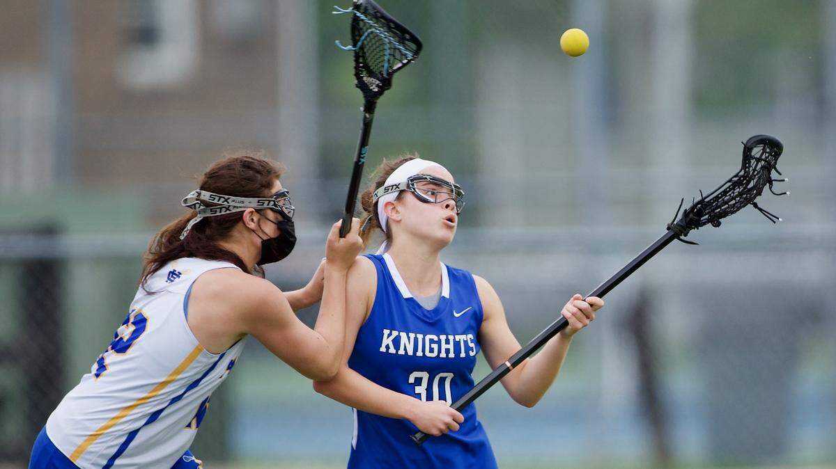 Lexington Catholic’s Morgan Cameron battled to cradle the ball against Henry Clay’s Tori Sloane during match on May 2 at Henry Clay. The boys’ and girls’ teams at Henry Clay each won the 2021 Commonwealth Lacrosse League state championship.