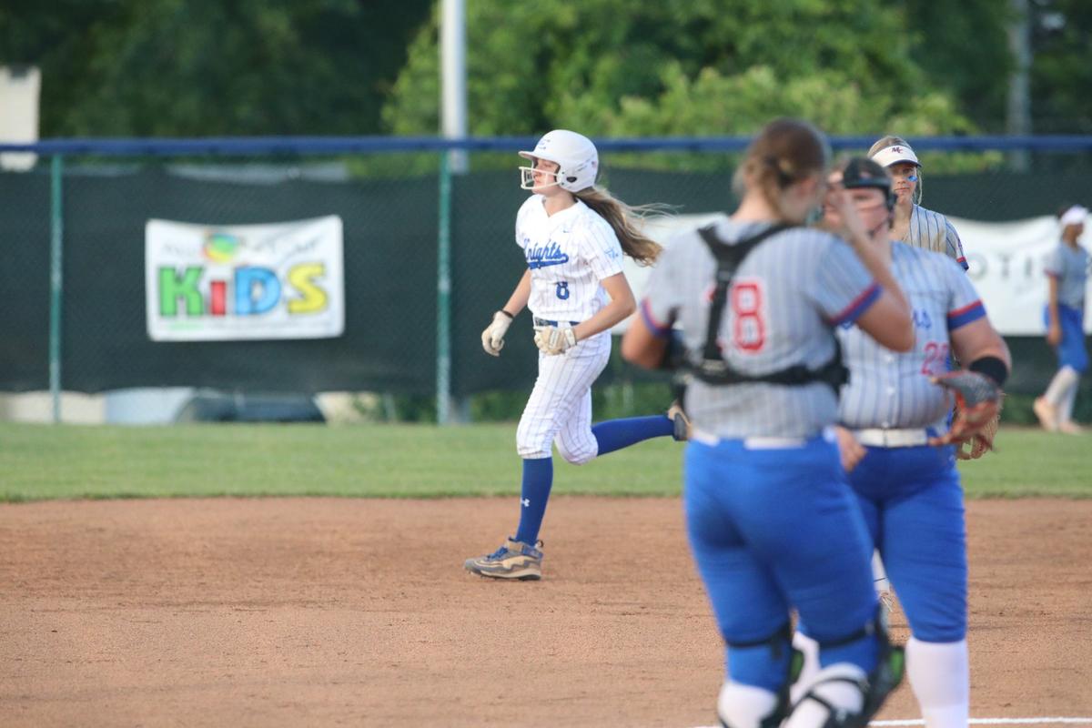Lexington Catholic’s Lydia Kennedy (8) runs the bases after hitting her second home run for the season during the Knights’ 11th Region championship game victory against Madison Central.