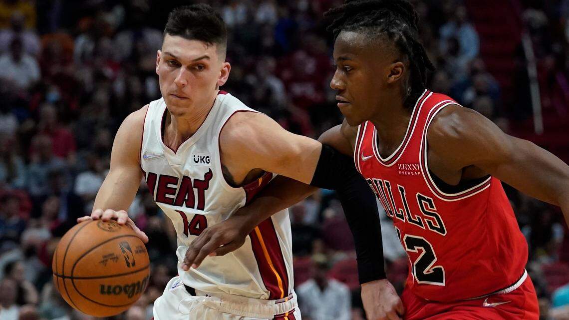 The Heat’s Tyler Herro, left, moved the ball against the Bulls’ Ayo Dosunmu during a game on Feb. 28 in Miami.