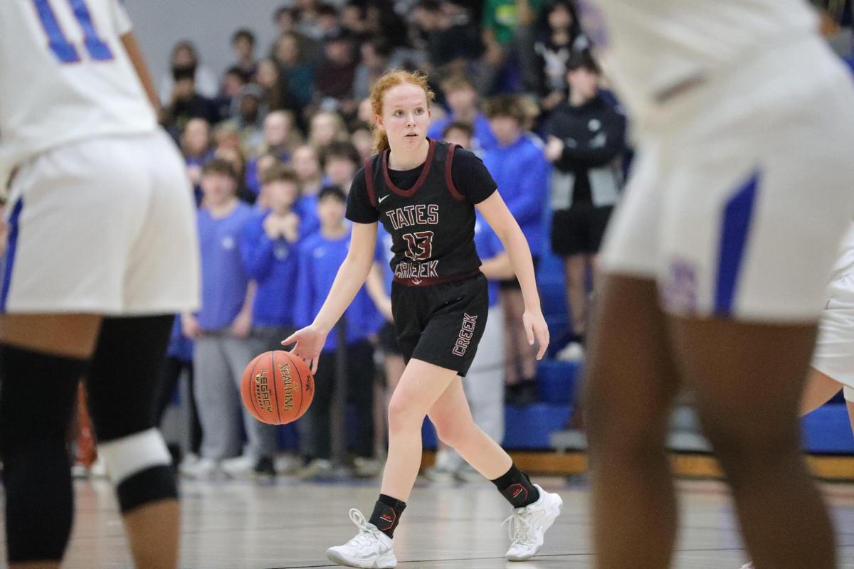 Tates Creek’s Chloe Byrd (33) moves the ball down court during the girls 43rd District Tournament championship game on Friday.