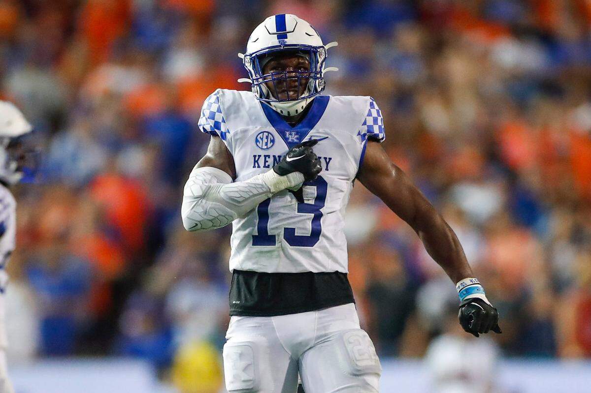Kentucky Wildcats linebacker J.J. Weaver (13) celebrates after making a tackle to stop the Florida Gators during the game at Ben Hill Griffin Stadium in Gainesville, Fl., Saturday, September 10, 2022.