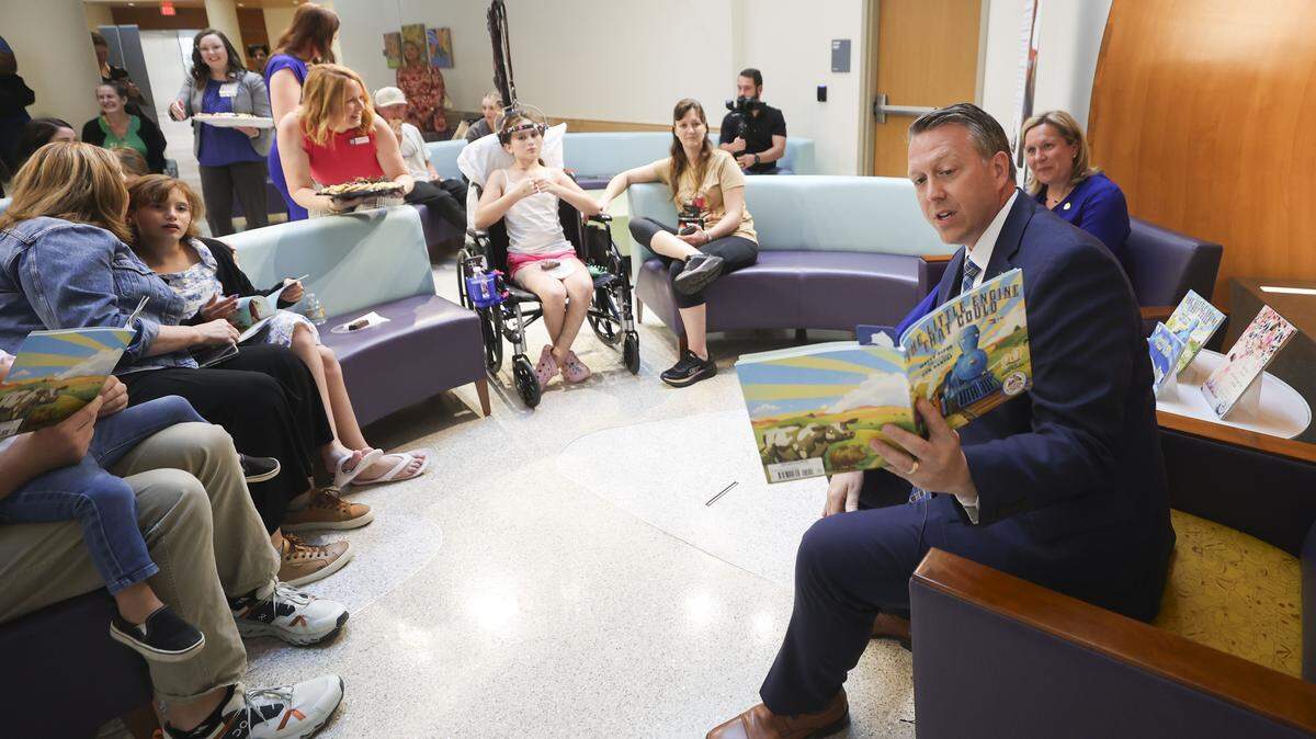 Dr. Scottie Day announces that UK Golisano Children’s is now an affiliate for Dolly Parton’s Imagination Library. State Rep. Chad Aull and State Sen. Amanda Mays Bledsoe read to some of the children on June 3, 2026. Photo by Carter Sloss | UKphoto