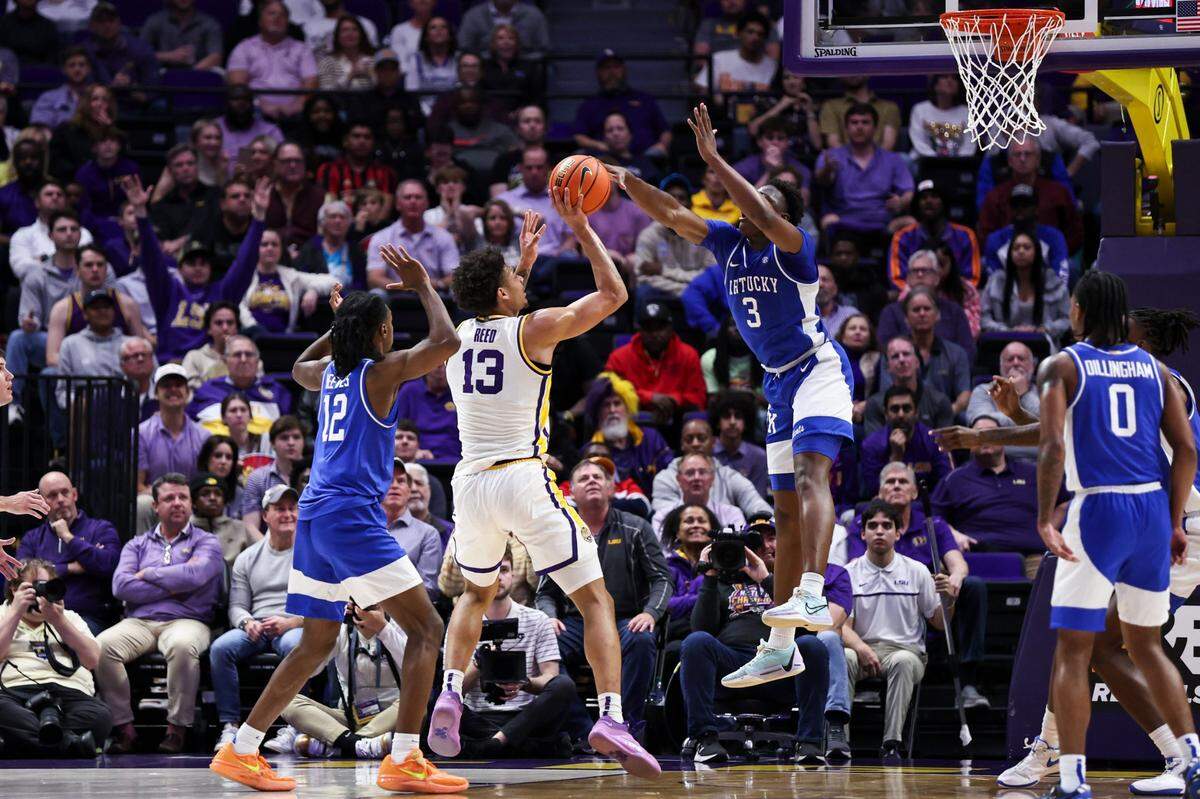 Adou Thiero (3) blocks a shot by LSU’s Jalen Reed (13) on Wednesday, one of Thiero’s four blocks on the night. The Wildcats’ defense must contend with the nation’s top-rated offense when Alabama visits on Saturday.