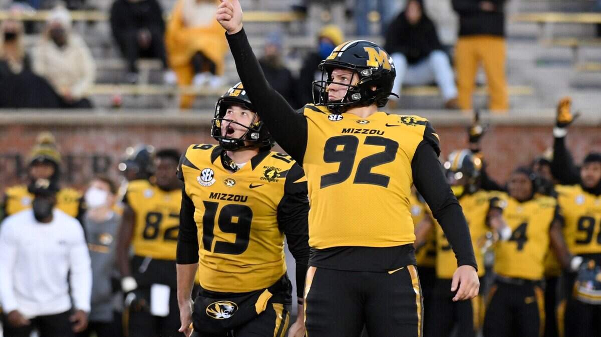 Missouri place kicker Harrison Mevis (92) celebrates alongside teammate Grant McKinniss (19) after kicking a 20-yard field goal during the second half of an NCAA college football game against Kentucky Saturday, Oct. 24, 2020, in Columbia, Mo. (AP Photo/L.G. Patterson)