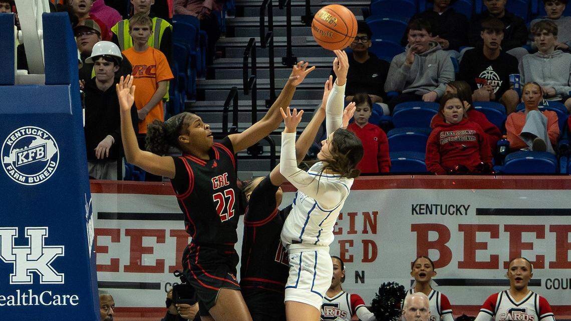 George Rogers Clark’s Eliyah Strode (22) and Teigh Yeast (12) go up to defend a shot by North Laurel’s Haley Comb during the Clark’s Pump-N-Shop Girls’ Basketball Sweet 16 state tournament first round at Rupp Arena on Thursday.