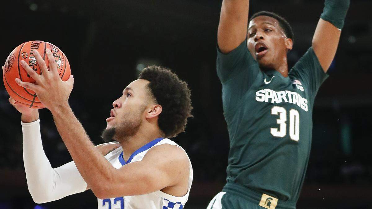 Kentucky Wildcats forward EJ Montgomery (23) shoots past Michigan State Spartans forward Marcus Bingham Jr. (30) during the State Farm Champions Classic at Madison Square Garden in New York City, Tuesday, Nov. 5, 2019.