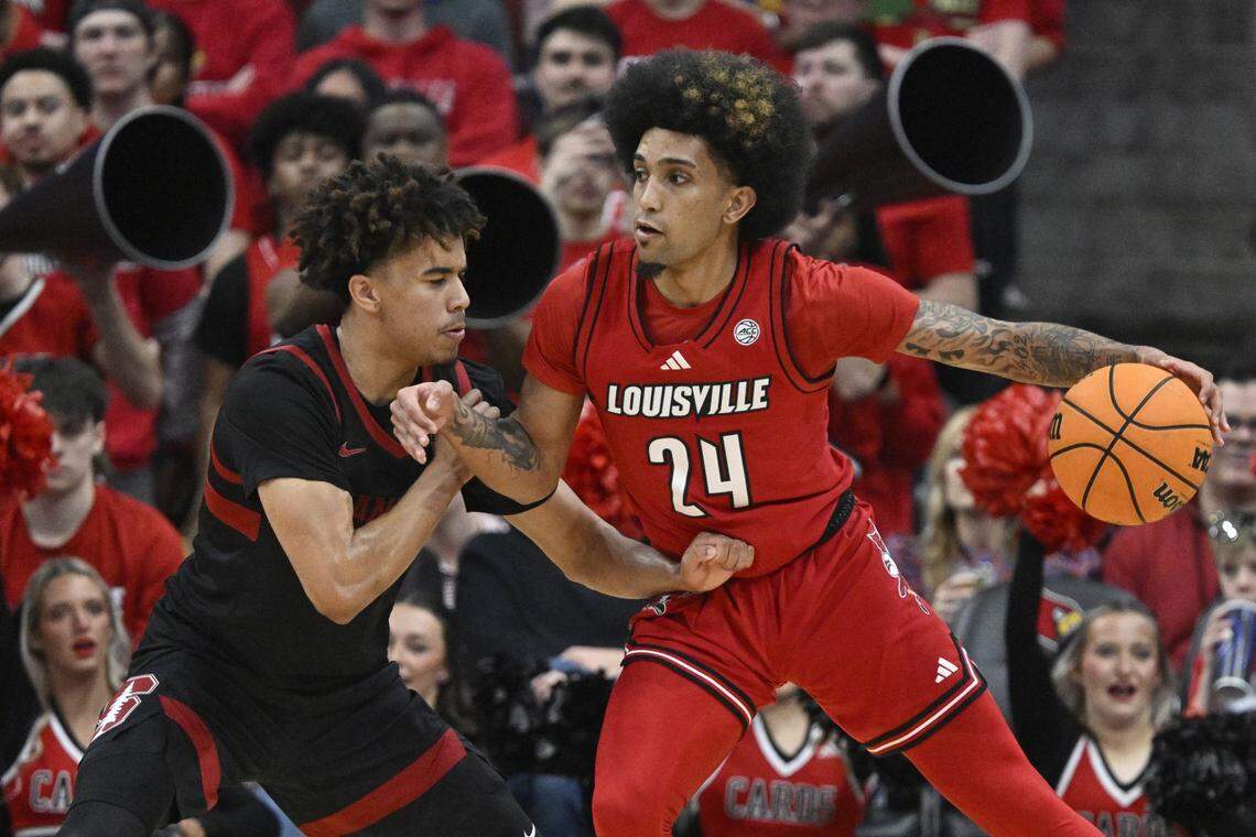 Mar 8, 2025; Louisville, Kentucky, USA;  Louisville Cardinals guard Chucky Hepburn (24) dribbles against Stanford Cardinal guard Oziyah Sellers (4) during the first half at KFC Yum! Center. Louisville defeated Stanford 68-48. Mandatory Credit: Jamie Rhodes-Imagn Images