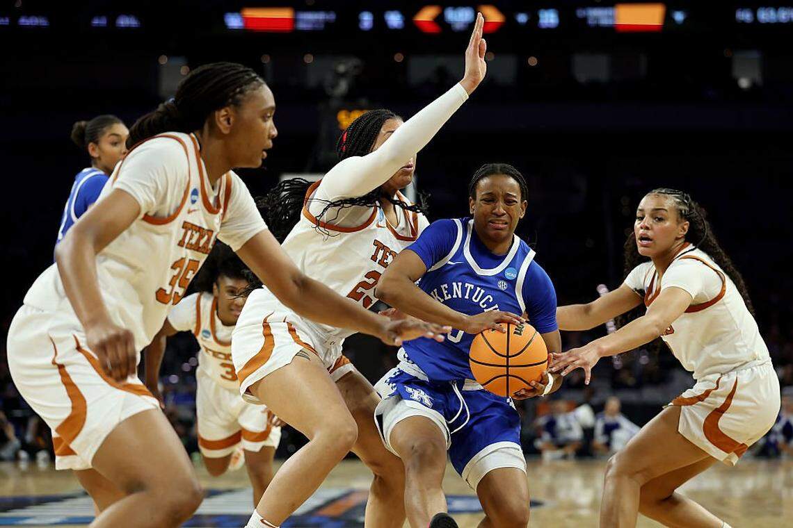 FORT WORTH, TEXAS - MARCH 28: Madison Booker #35, Breya Cunningham #25 and Jordan Lee #7 of the Texas Longhorns defend against Jordan Obi #0 of the Kentucky Wildcats during the first quarter in the Sweet Sixteen of the 2026 NCAA Women's Basketball Tournament at Dickies Arena on March 28, 2026 in Fort Worth, Texas. (Photo by Elsa/Getty Images)