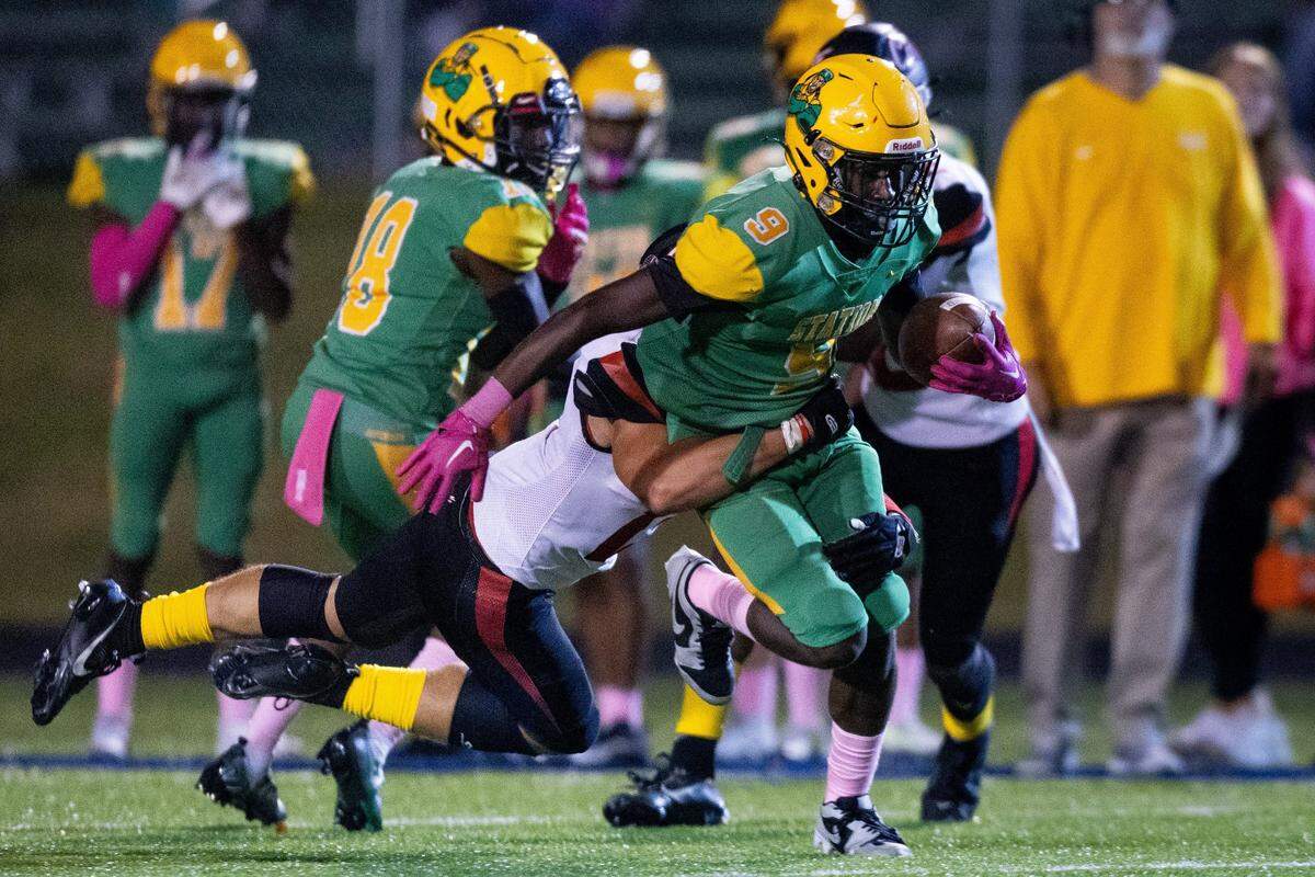 Bryan Station wide receiver Demond Green (9) runs the ball against George Rogers Clark on Friday.