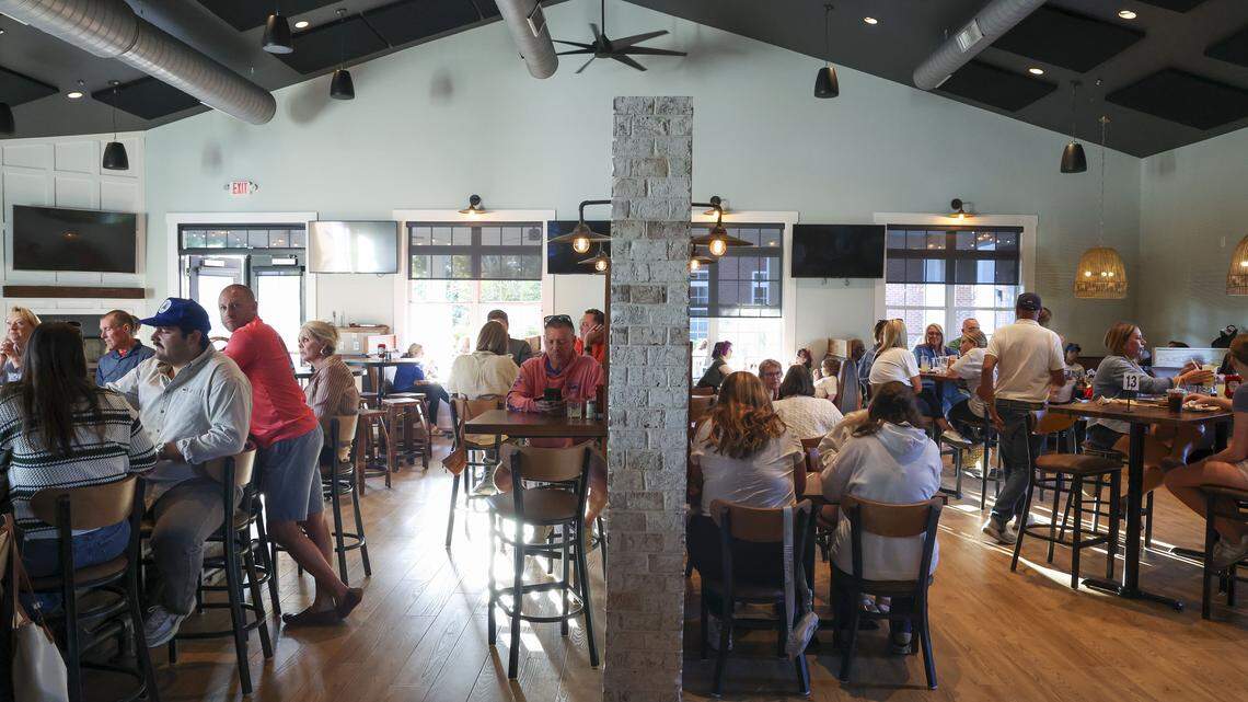 The bar and dining area at Southern Cookhouse & Bar, photographed Sunday, Sept.  7, in Lexington, Ky., is divided by partial wall. The new sports bar and restaurant has a menu of burgers, Southern comfort food, pizza and sandwiches. 